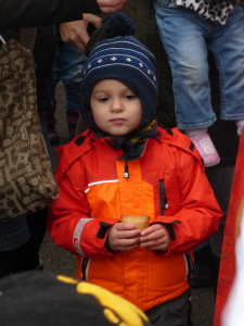 A young child waits with his treat given to him by St. Nikolaus and Knecht Ruprecht.